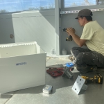 Kai, Trent preparing Unistrut mounting brackets for SAM at Biosphere 2