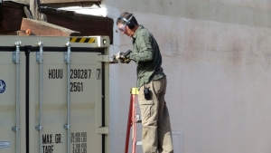 Kai Staats cutting hinge bolts at SAM, Biosphere 2