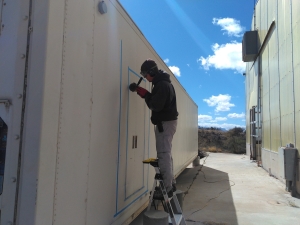 Kai cutting the airlock entry at SAM, Biosphere 2