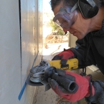 Kai and Colleen cut a doorway from the crew quarters into the workshop at SAM, Biosphere 2