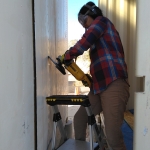 Kai and Colleen cut a doorway from the crew quarters into the workshop at SAM, Biosphere 2