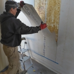 Kai and Colleen cut a doorway from the crew quarters into the workshop at SAM, Biosphere 2