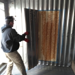 Kai and Colleen cut a doorway from the crew quarters into the workshop at SAM, Biosphere 2
