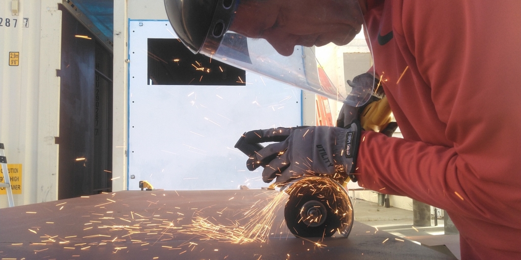 Kai Staats cutting steel at SAM, Biosphere 2