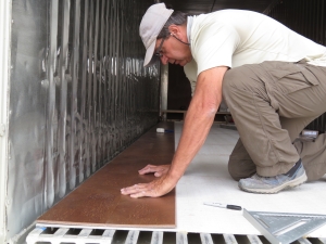 John Z. laying the second row of cork flooring at SAM, Biosphere 2