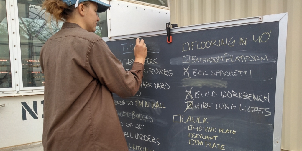 Luna adds another task to the SAM project blackboard at Biosphere 2