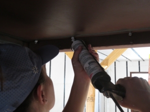 Luna applies 795 silicon to screw heads in SAM at Biosphere 2