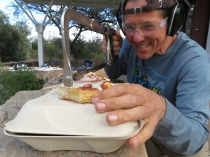 Kai cutting a cinnamon roll at SAM, Biosphere 2