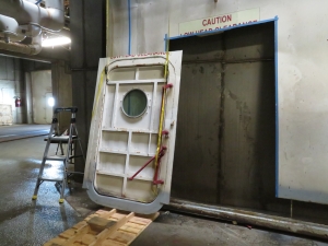 Nathan Schmit, Kai Staats salvaging an original pressure door from Biosphere 2 for SAM.