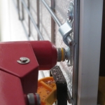 Rivets secure the FRP to the framing of the crew quarters to workshop bridge at SAM, Biosphere 2