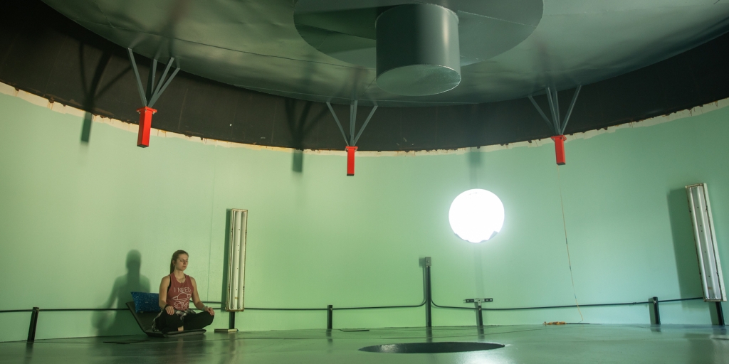 Crew Engineer Bailey Burns meditating in the lung at SAM, Biosphere 2 - photo by Cassandra Klos (@cassandraklos)