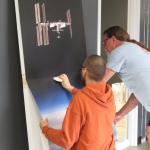 Application of a large format vinyl print to the interior doors of the SAM Operations Center at Biosphere 2