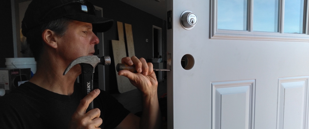 Kai Staats setting the front door at SAM Operations Center, Biosphere 2