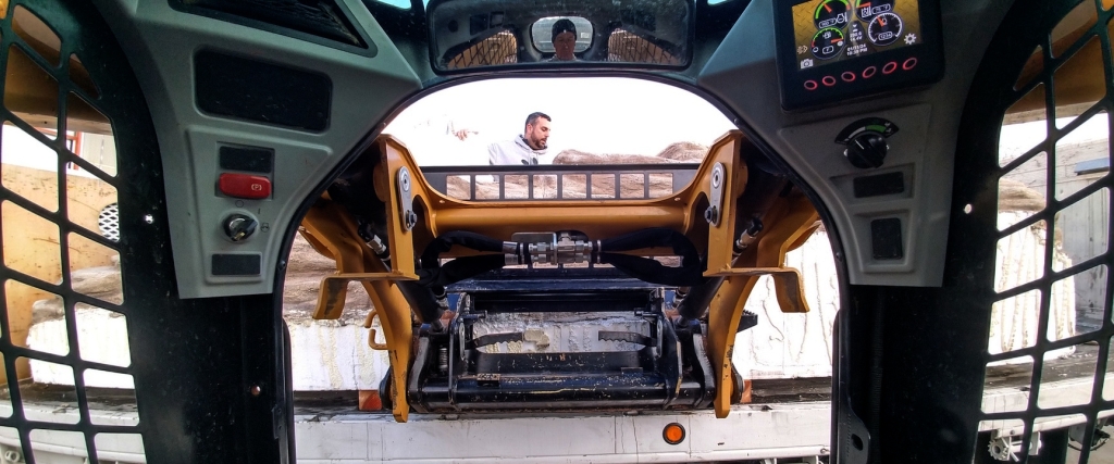 Kai Staats maneuvers forklift to unload a section of a Hollywood set